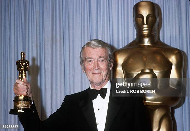 Actor James Stewart holds his honorary Oscar 25 March 1985 in Hollywood at the 57th Annual Academy Awards.