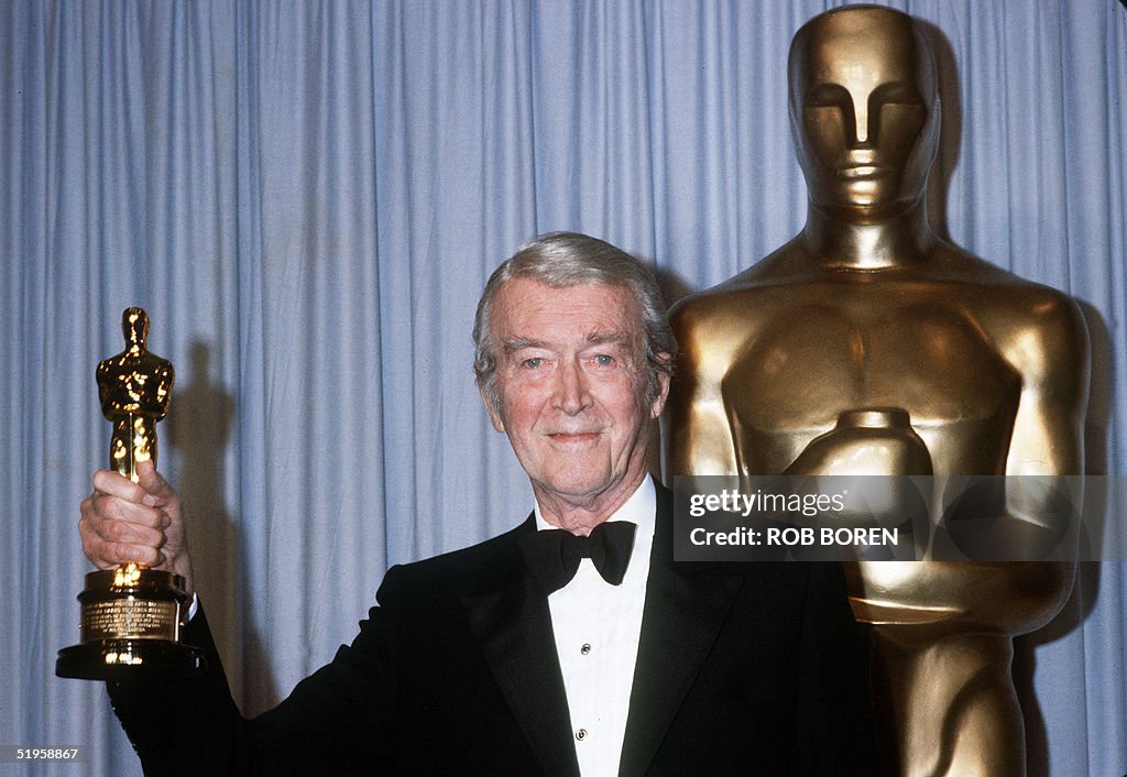 US actor James Stewart holds his honorary Oscar 25 March 1985 in
