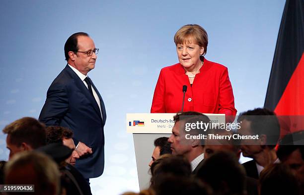 French President Francois Hollande and German Chancellor Angela Merkel arrive to attend a press conference during the 18th Franco-German cabinet...