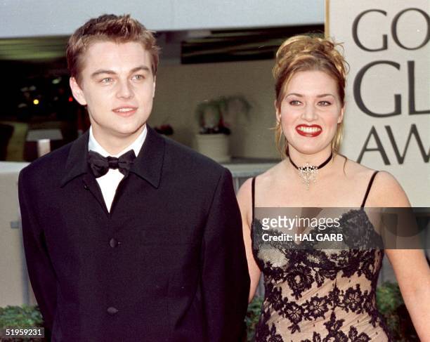 Actor Leonardo DiCaprio arrives with actress and Titanic co-star Kate Winslet for the 55th Annual Golden Globe Awards at the Beverly Hilton 18...