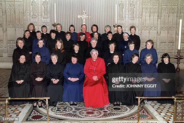 Anglican Bishop Barry Rogerson of Bristol , smiles while posing with the thirty two women deacons during a photo session in Bristol Cathedral on 10...