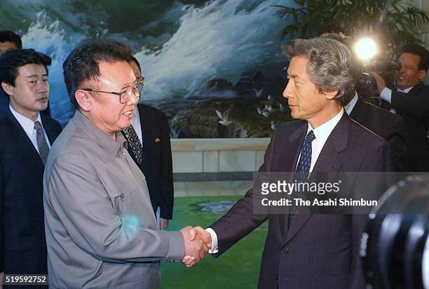 Japanese Prime Minister Junichiro Koizumi and North Korean leader Kim Jong-il shake hands after during their meeting at the Pakhuawon guest house on...