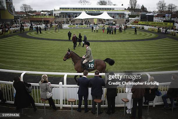 Racegoers enjoy the atmosphere on the first day of the Aintree Grand National Festival meeting on April 7, 2016 in Aintree, England. Today is the...