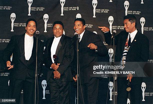 Four members of the Jackson Five brothers Marlon, Tito, Jackie and Jermaine Jackson pose for the media after they were inducted into the 12th Annual...