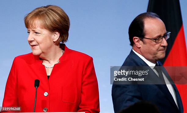 French President Francois Hollande and German Chancellor Angela Merkel arrive to attend a press conference during the 18th Franco-German cabinet...