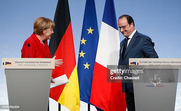 French President Francois Hollande and German Chancellor Angela Merkel leave after a press conference during the 18th Franco-German cabinet meeting...