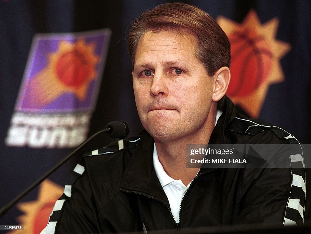 Phoenix Suns' head coach Danny Ainge pauses while