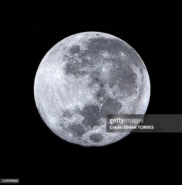 This photo shows the last full moon of this millennium 22 December 1999 as seen from Mexico City. Vista de la ultima luna llena de este Milenio desde...