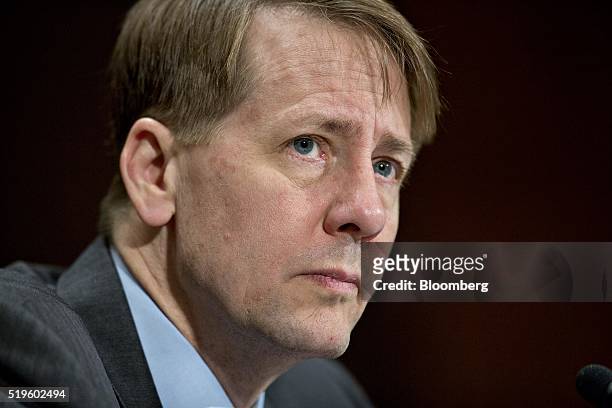 Richard Cordray, director of the Consumer Financial Protection Bureau , listens during a Senate Banking Committee hearing in Washington, D.C., U.S.,...