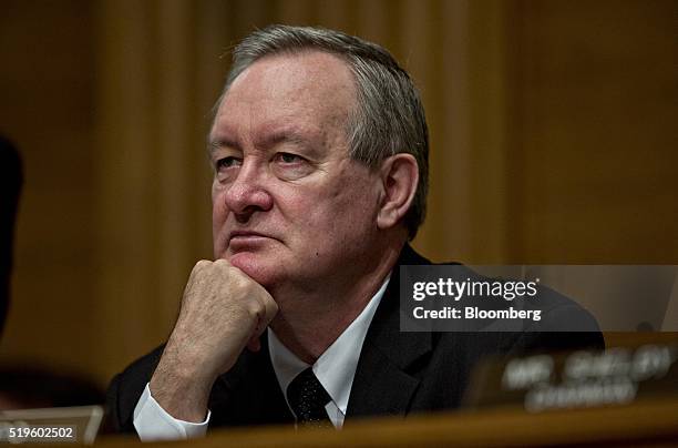 Senator Mike Crapo, a Republican from Idaho, listens during a Senate Banking Committee hearing with Richard Cordray, director of the Consumer...