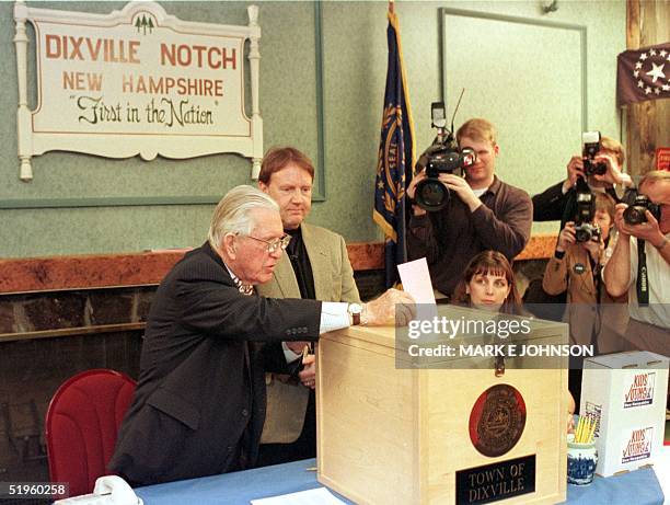 New Hampshire's oldest resident and town moderator Neil Tillotson, who is 101 years old, casts the first ballot in the 2000 primary elections in...