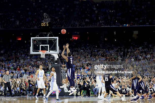 Kris Jenkins of the Villanova Wildcats shoots the game-winning three pointer to defeat the North Carolina Tar Heels 77-74 in the 2016 NCAA Men's...