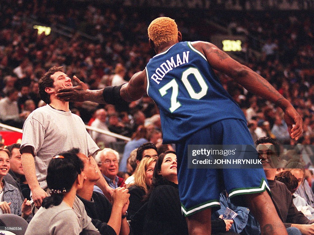 Dallas Maverick forward Dennis Rodman jokingly sla