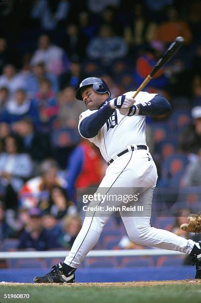 Cecil Fielder of the Detroit Tigers hits a home run during a season game against the Texas Rangers at Tiger Stadium on May 4, 1994 in Detroit,...