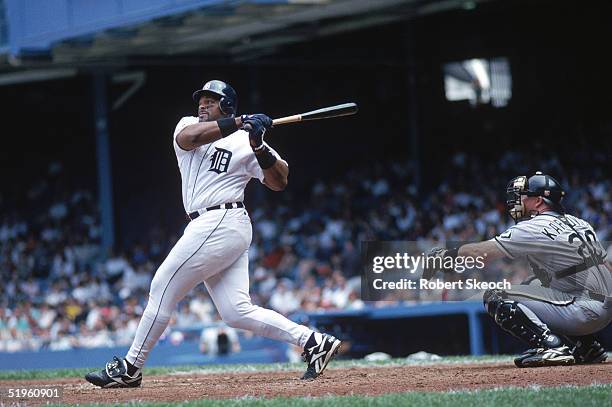 Cecil Fielder of the Detroit Tigers makes a hit during a 1996 season game against the Chicago White Sox. Cecil Fielder played for the Toronto Blue...