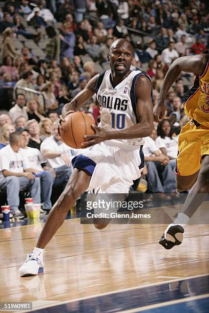 Darrell Armstrong of the Dallas Mavericks drives against the Atlanta Hawks December 18, 2004 at the American Airlines Center in Dallas, Texas. The...