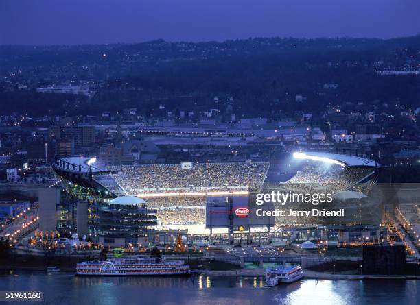 Elevated view of Heinz Field with the Pittsburgh skyline background at dusk, as the Pittsburgh Steelers host the New York Jets on December 12, 2004...