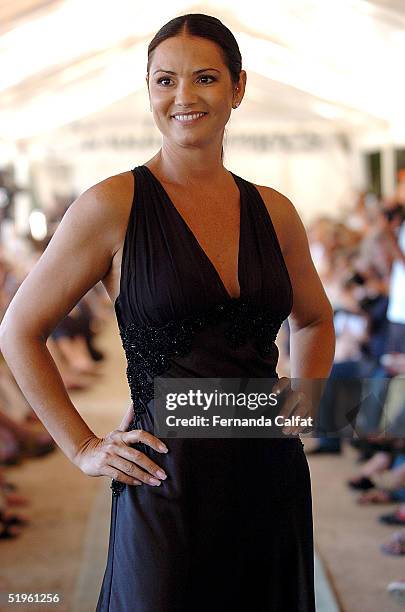 Model Luiza Brunet presents a design by Claudia Simoes during the Fall/Winter 2005 collection of the Rio Fashion Week at Rio's Brazilian Equestrian...