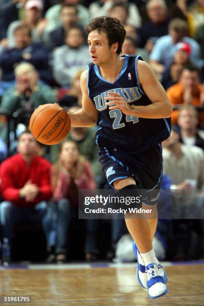 Raul Lopez of the Utah Jazz dribbles the ball down the court against the Sacramento Kings during the game on January13 at Arco Arena in Sacramento,...