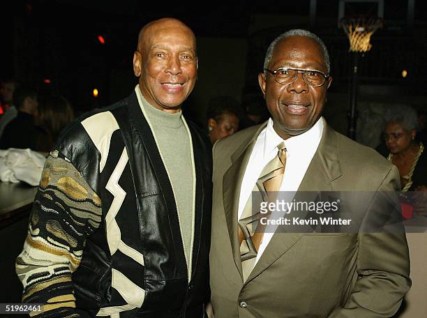 National Baseball Hall of Fame members Ernie Banks and Hank Aaron pose at the afterparty for the premiere of Paramounts' "Coach Carter" at The...