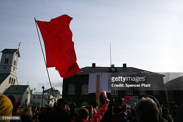Hundreds of protesters gather in front of the Parliament building holding red cards for a fourth day on April 7, 2016 in Reykjavik, Iceland....