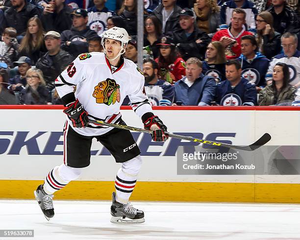 Viktor Svedberg of the Chicago Blackhawks keeps an eye on the play during third period action against the Winnipeg Jets at the MTS Centre on April 1,...