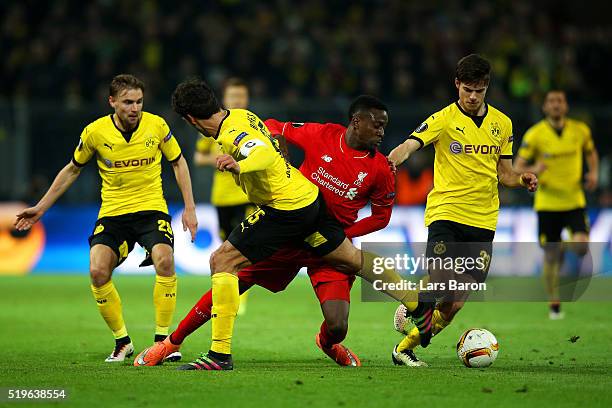 Divock Origi of Liverpool takes on Marcel Schmelzer , Mats Hummels and Julian Weigl of Borussia Dortmund during the UEFA Europa League quarter final...