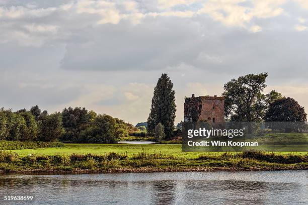 nijenbeek castle - a view from the river ijssel - gelderland stock pictures, royalty-free photos & images