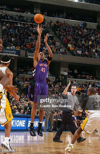 Donyell Marshall of the Toronto Raptors shoots against Fred Jones of the Indiana Pacers December 17, 2004 at Conseco Fieldhouse in Indianapolis,...