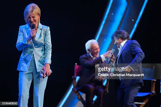 Carmen Nebel, Tony Christie and Andy Borg perform on stage during the tv show 'Willkommen bei Carmen Nebel' at Tempodrom on April 7, 2016 in Berlin,...