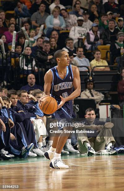 Howard Eisley of the Utah Jazz takes the ball down the court against the Utah Jazz at the Fleet Center on December 17, 2004 in Boston, Massachusetts....