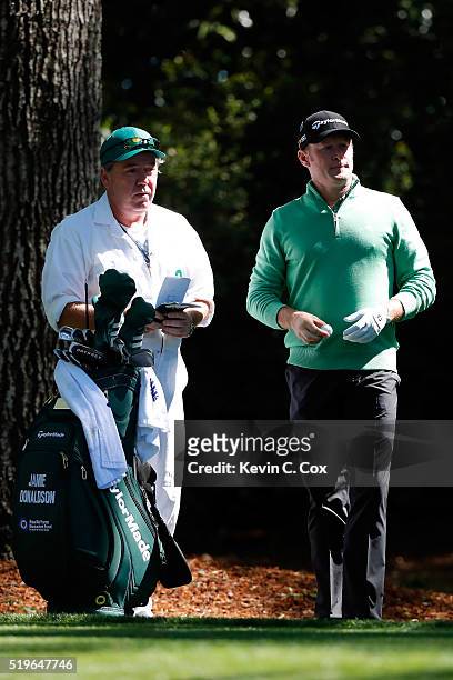Jamie Donaldson of Wales and caddie Michael "Mick" Donaghy prepares to play from the second tee during the first round of the 2016 Masters Tournament...