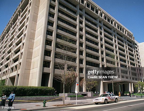 Police are positioned near the International Monetary Fund building 10 April 2000 in Washington, DC. Specially trained police officers to deal with...