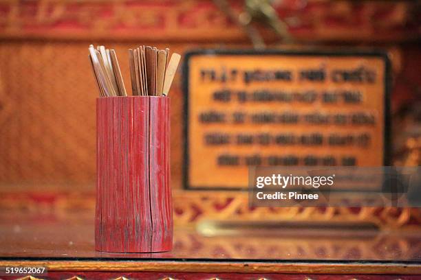 sortilege with bambbo stick, vietnam - fortune stick stock pictures, royalty-free photos & images