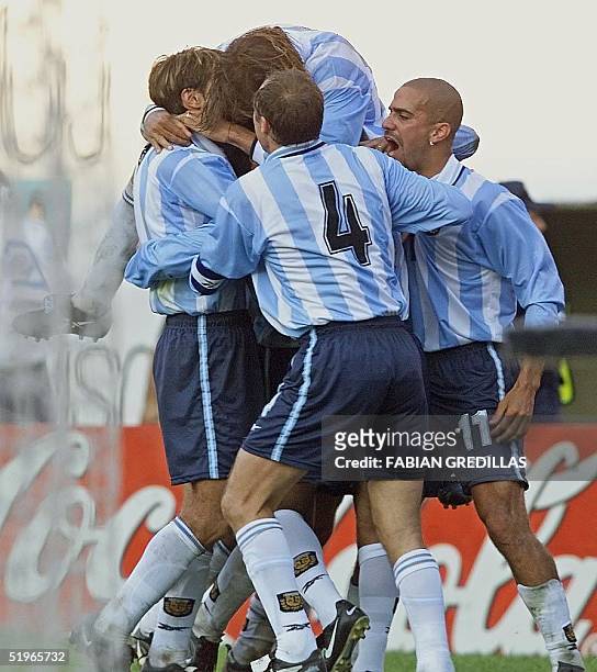 Claudio Lopez, Gabriel Batistuta, Roberto Sensini and Juan Veron of Argentina embrace teammate Gustavo Lopez after he scored a goal for the team 04...