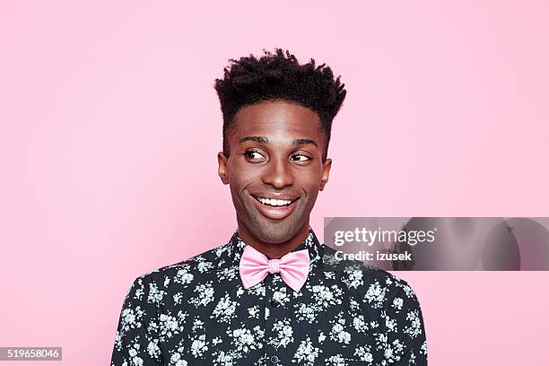 funky afro american guy against pink background - young male model stockfoto's en -beelden