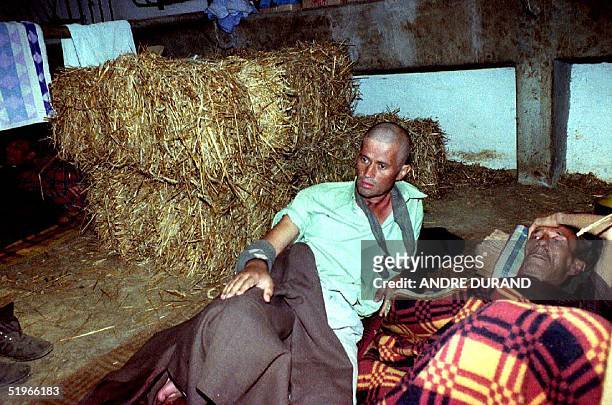 Two Bosnian prisoners lay in the makeshift infirmary of the Serbian internment camp for Bosnians in Manjaca, 40 km from Banja Luka, 14 August 1992 ....