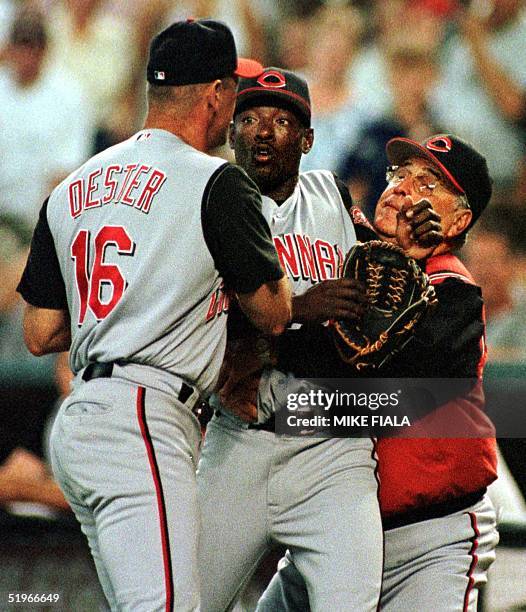 Cincinnati Reds pitcher Manny Aybar is restrained by teammate Ron Oester and manager Jack McKeon after he was ejected from the game in the fifth...