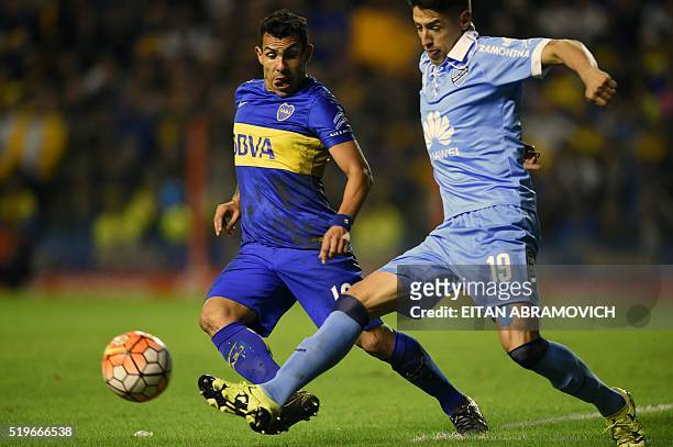 Bolivia's Bolivar player midfielder defender Nelson Cabreravies for the ball against Argentinas Boca Juniors player forward forward Carlos Tevez...