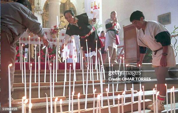 Local Tzeltale Indians light candles, 26 December 1994, at the cathedral during a ceremony of support for Bishop Samuel Ruiz who is on a hunger...