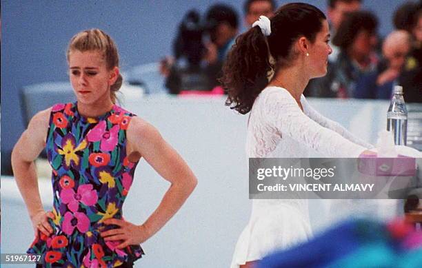 Figure skaters Tonya Harding and Nancy Kerrigan avoid each other during a training session 17 February in Hamar, Norway, during the Winter Olympics....