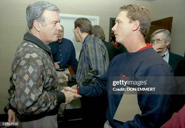 Dave Cone of the Kansas City Royals shakes hands with Colorado Rockies owners Jerry McMorris 14 December after baseball talks ended at Arrowwood...