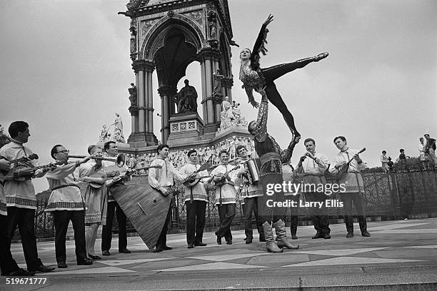 Dancers from the Bolshoi Theatre, Nicholai Trubsky and Julia Romanenko, entertain the crowd by the Albert Memorial in Kensington Gardens, London, 3rd...