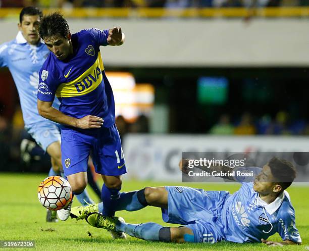 Nicolas Lodeiro of Boca Juniors fights for the ball with Nelson Cabrera of Bolivar during a match between Boca Juniors and Bolivar as part of Group 3...