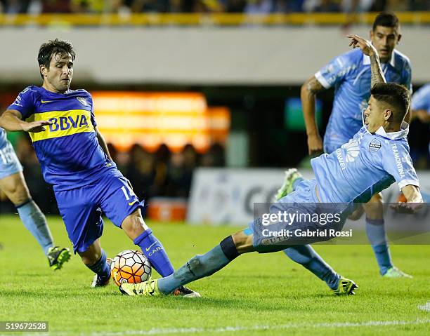 Nicolas Lodeiro of Boca Juniors fights for the ball with Nelson Cabrera of Bolivar during a match between Boca Juniors and Bolivar as part of Group 3...