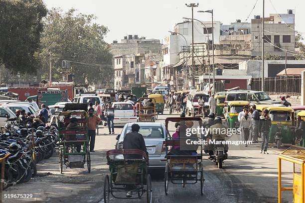 traffic in downtown - delhi street stock pictures, royalty-free photos & images