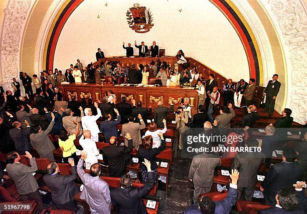 President of the new Venezuelan National Assembly William Lara takes the oath of office in Caracas, 14 August 2000, along with the new 165-member...