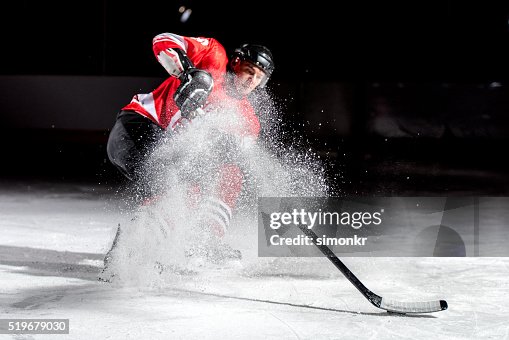 Man playing ice hockey Man playing ice hockey