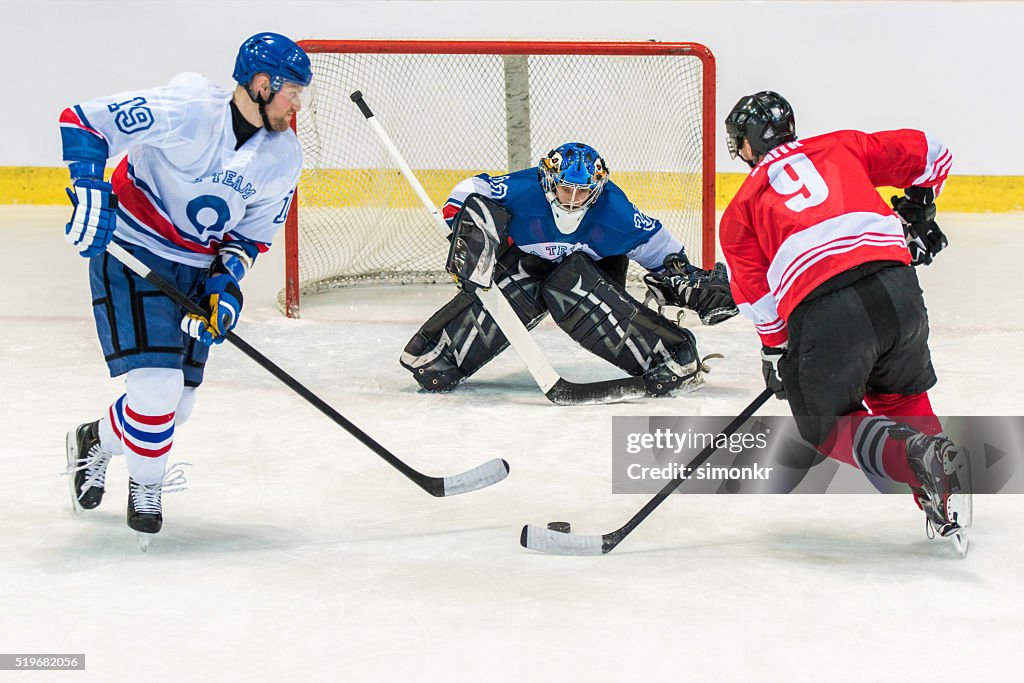 Men playing ice hockey