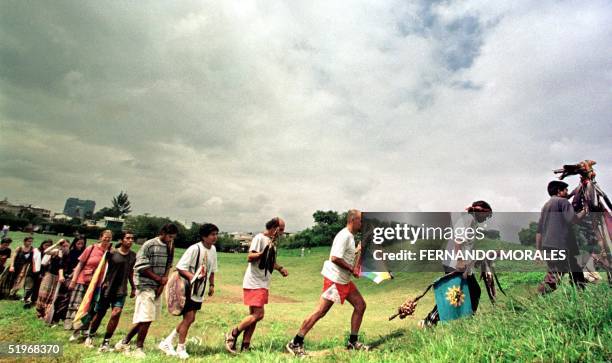 Group of indigenous people arrives at the archaeological site of Kaminaljuyu in Guatemala City for a Mayan ceremony, 27 September 2000. The group of...